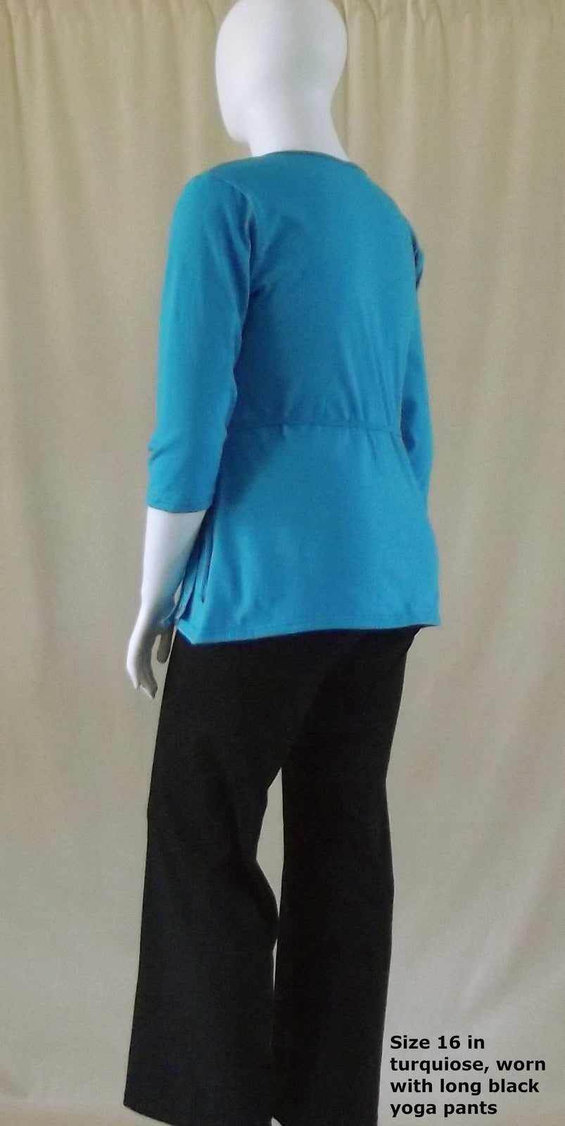 back view of turquoise 3/4 sleeve wrap top