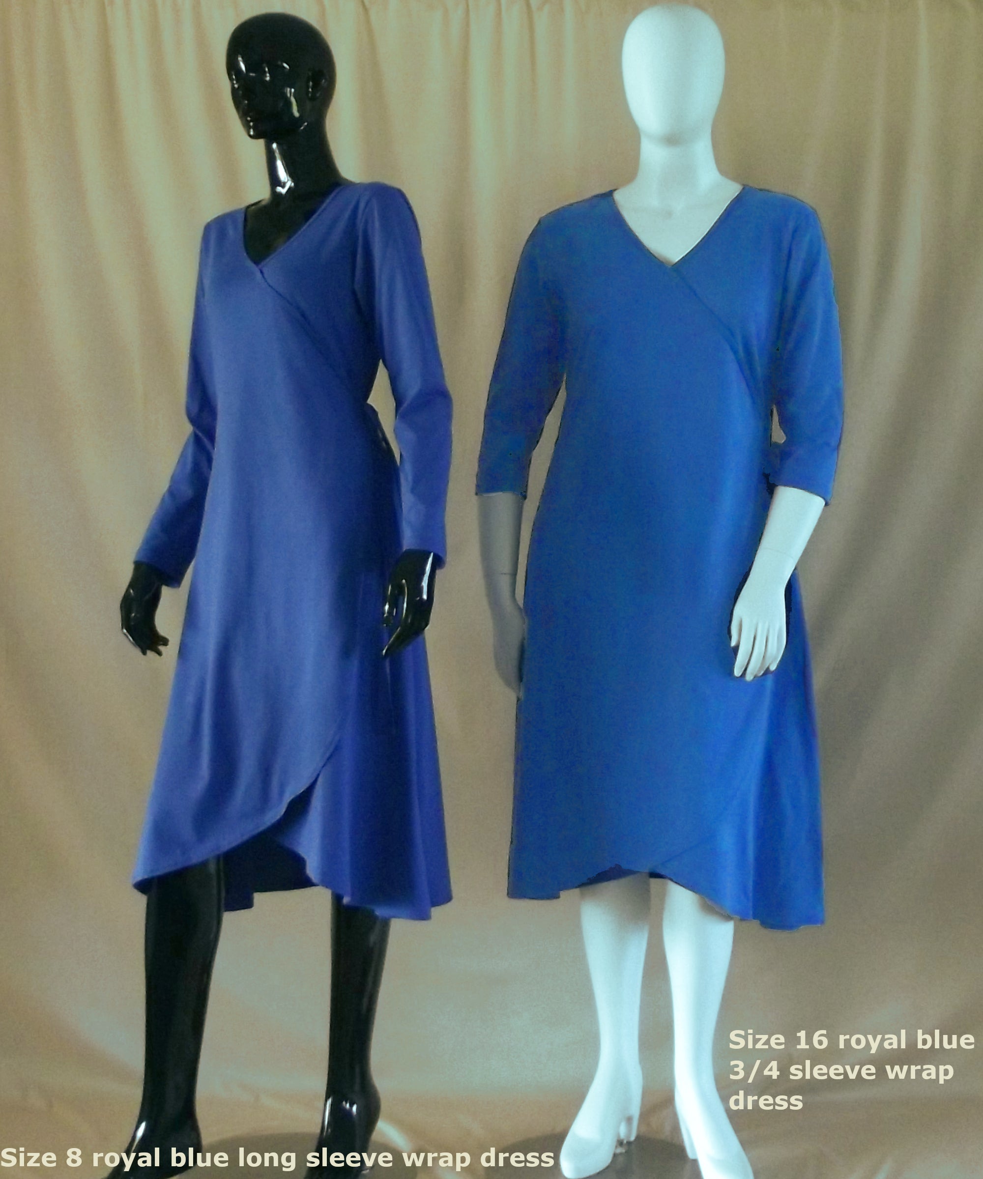1 plus size royal blue Australian made long sleeve cotton wrap dress standing beside 1 royal blue 3/4 sleeve cotton wrap dress