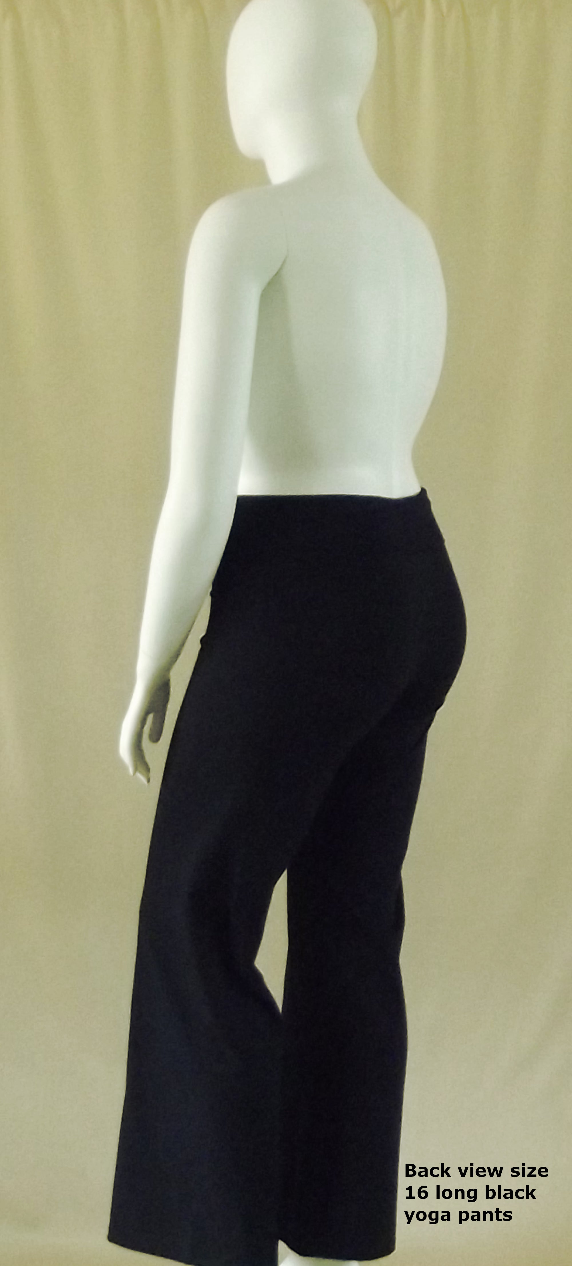 back view of plus size model wearing black cotton spandex long yoga pants