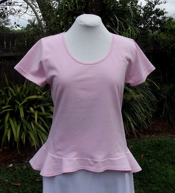baby pink women's cotton top with frilly peplum