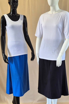 Australian made cotton A-line skirts in royal blue and black, worn with white cotton singlet and white boat neck t-shirt with elbow sleeves