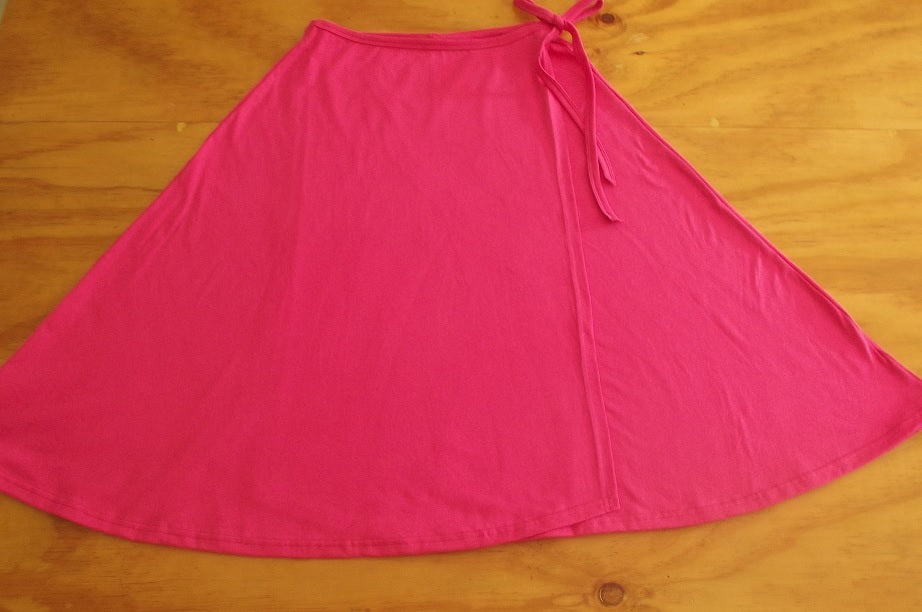 flat lay of hot pink cotton womens wrap skirt