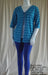 Plus size blue stripe tie front jacket worn with leggings and women's cotton singlet