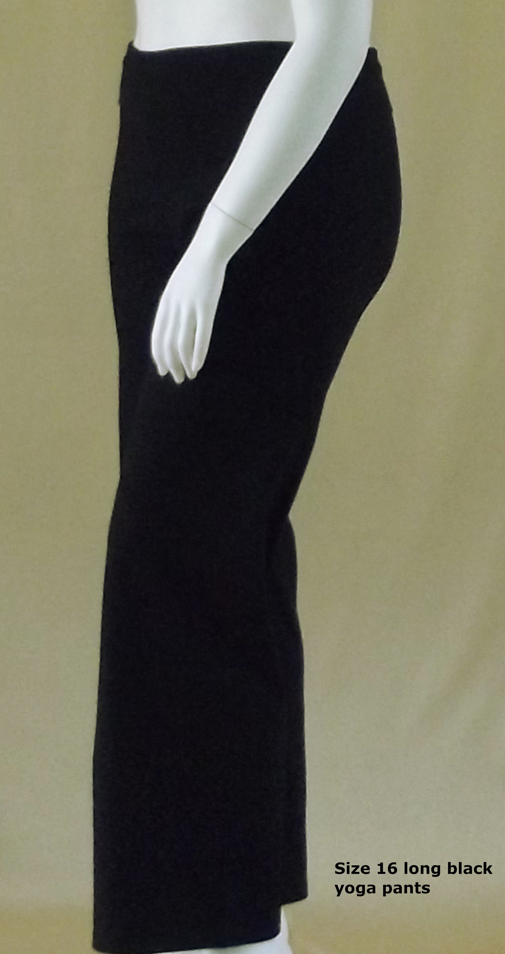 a plus size mannequin wearing black long yoga pants