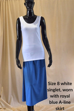 white cotton singlet and royal blue mid calf A-line skirt