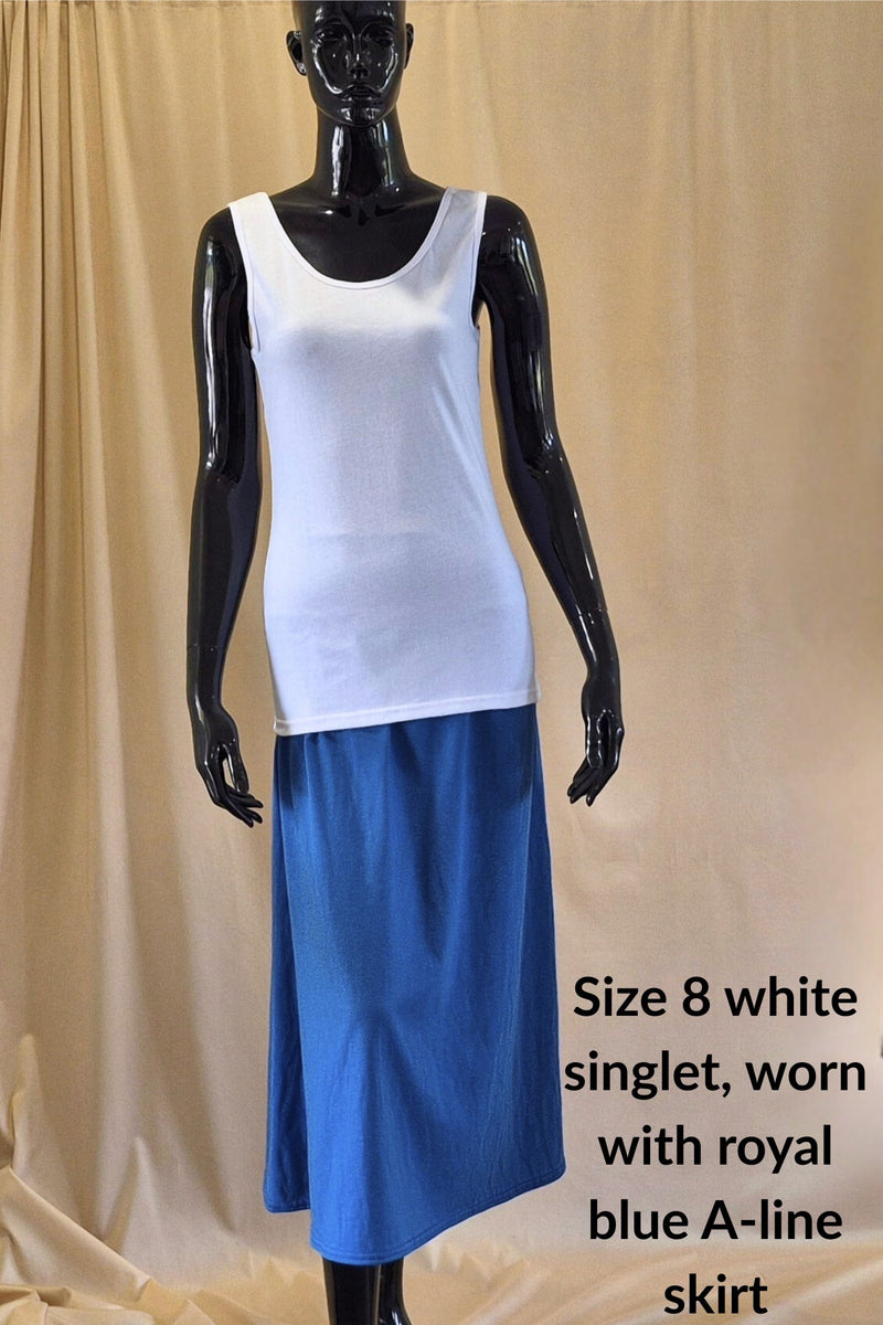 white cotton singlet and royal blue mid calf A-line skirt