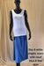 white cotton singlet and royal blue mid calf A-line skirt